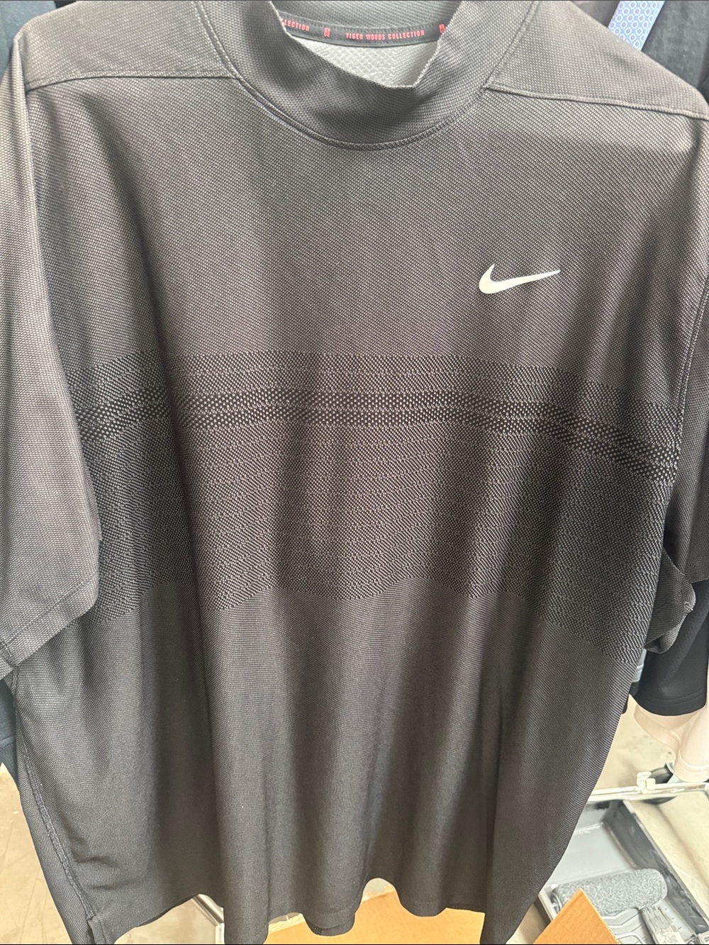 Nike Menโs Black Athletic Polo with White Swoosh